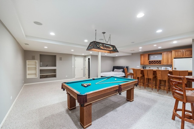 rec room featuring pool table, bar, and light carpet