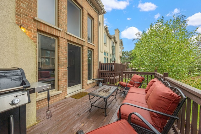 wooden terrace featuring grilling area