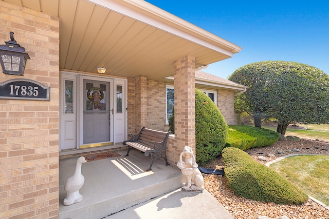 property entrance with covered porch