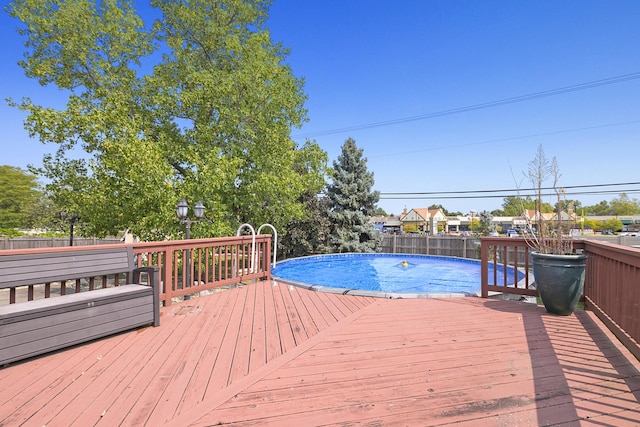 view of pool with a wooden deck