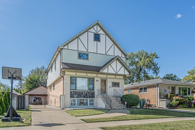 tudor home featuring a front lawn