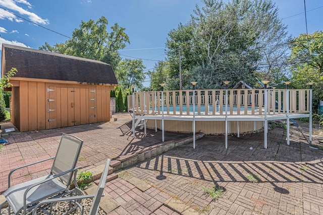 view of patio / terrace featuring a storage shed