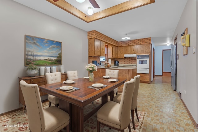 dining room featuring ceiling fan