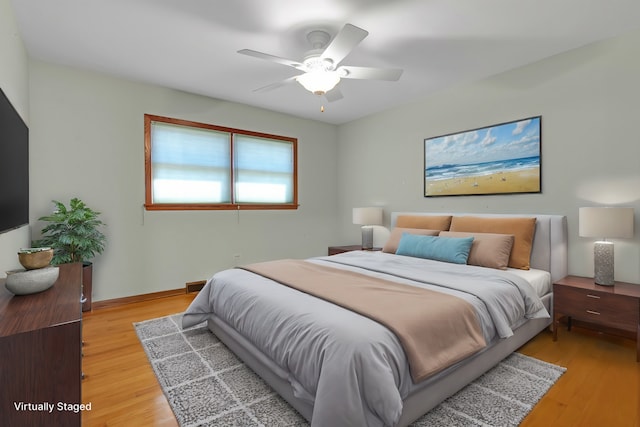 bedroom featuring light wood-type flooring and ceiling fan