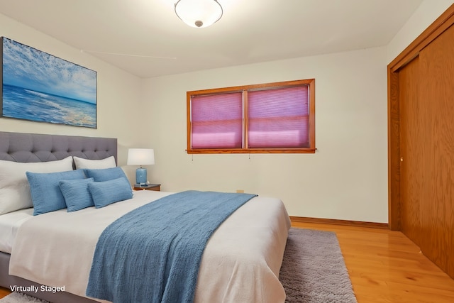 bedroom with light wood-type flooring