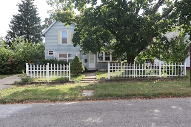 view of front of home with a front lawn