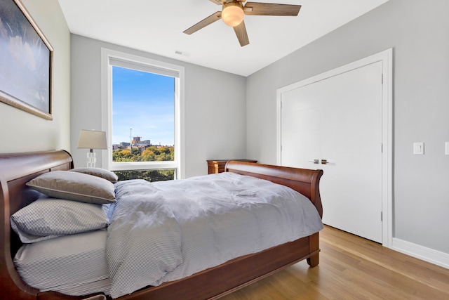 bedroom featuring light wood-type flooring and ceiling fan