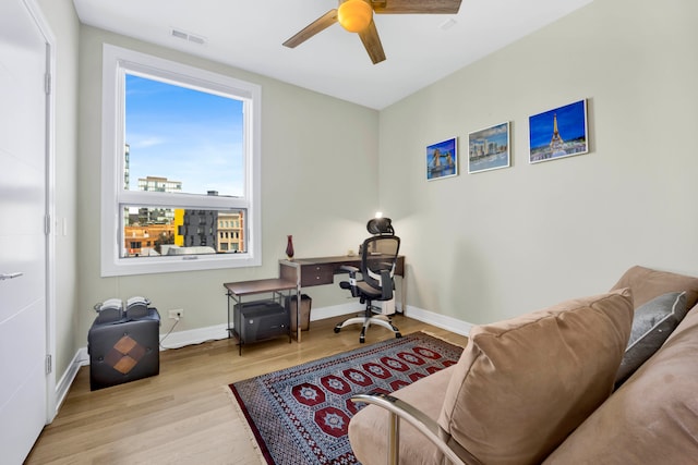 office area featuring light hardwood / wood-style floors and ceiling fan