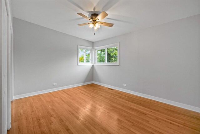 spare room with ceiling fan and light hardwood / wood-style floors