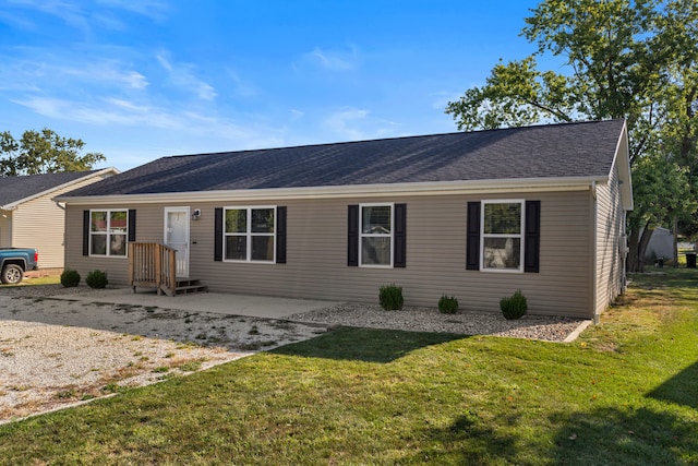 single story home with a patio and a front lawn