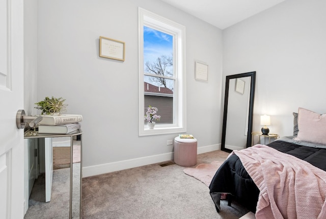 bedroom featuring carpet floors and baseboards