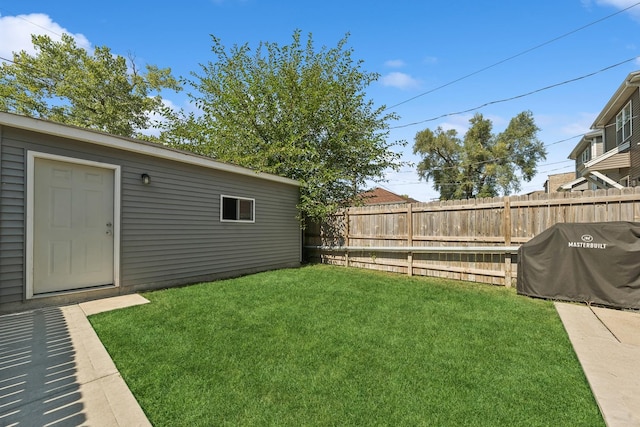 view of yard featuring an outdoor structure and fence