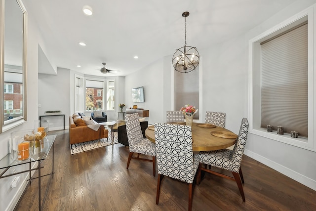 dining room featuring recessed lighting, dark wood-style flooring, baseboards, and ceiling fan with notable chandelier