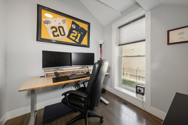 home office with lofted ceiling, visible vents, baseboards, and wood finished floors