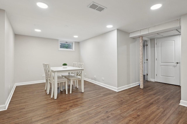 dining room with dark hardwood / wood-style floors