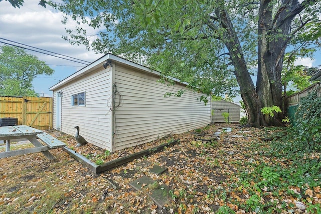 view of side of property with central air condition unit