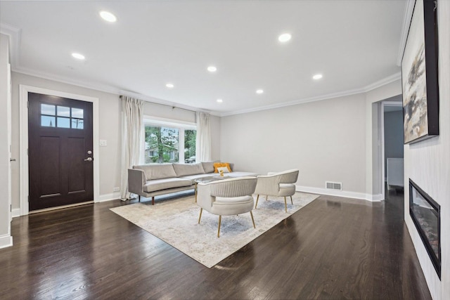 dining area with crown molding and dark hardwood / wood-style flooring