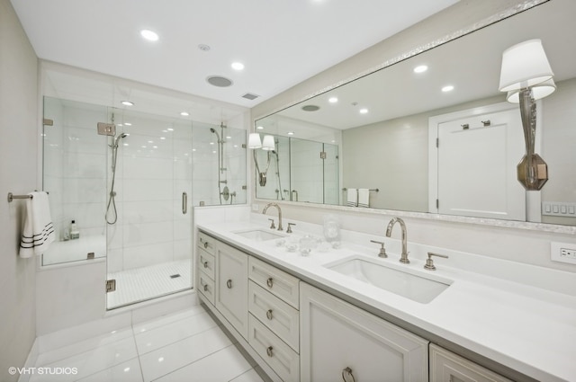 bathroom featuring vanity, tile patterned floors, and an enclosed shower