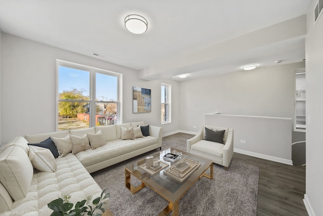 living room with dark hardwood / wood-style flooring