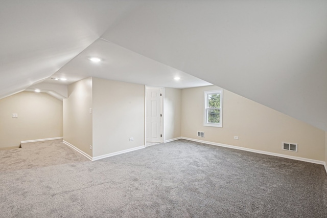 bonus room featuring carpet and lofted ceiling