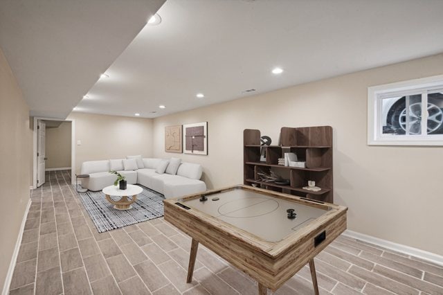 playroom featuring light wood-type flooring