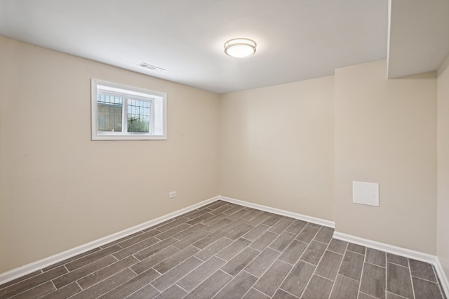 unfurnished room with dark wood-type flooring