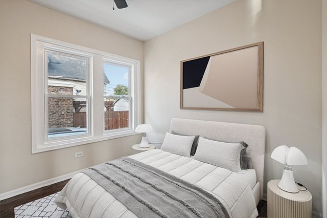 bedroom featuring ceiling fan and dark hardwood / wood-style floors