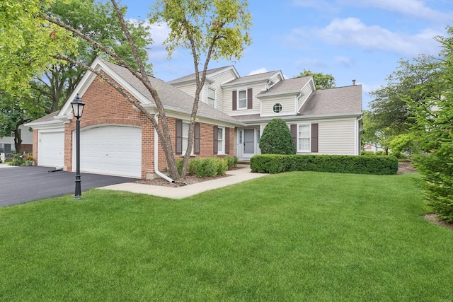 view of front facade featuring a garage and a front yard