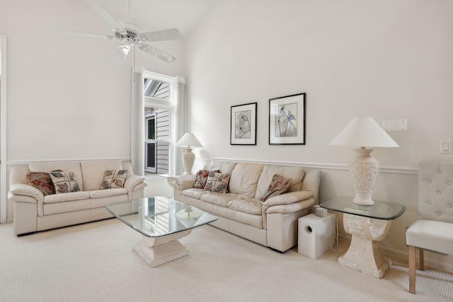 living room with carpet flooring, ceiling fan, and high vaulted ceiling