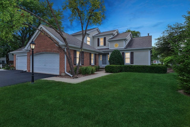 view of front facade featuring a garage and a front lawn