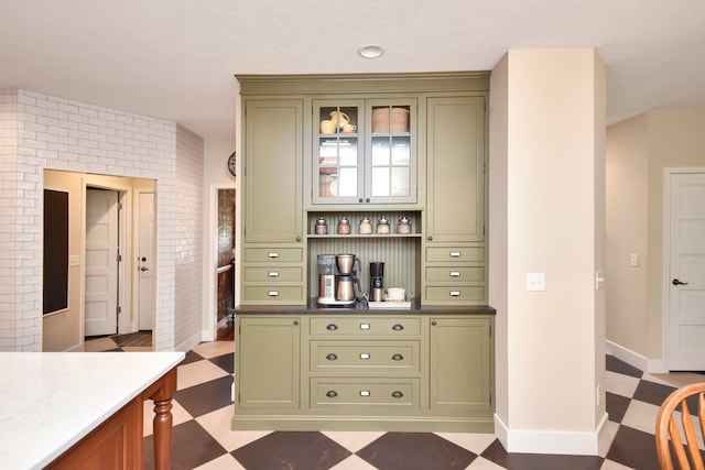 bar featuring green cabinets