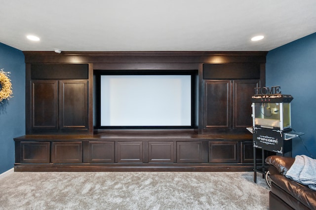 carpeted cinema room with ornamental molding