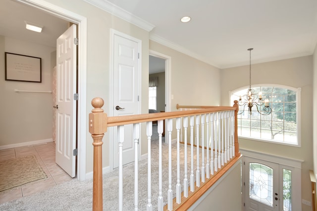 corridor featuring ornamental molding, a notable chandelier, and light tile patterned floors