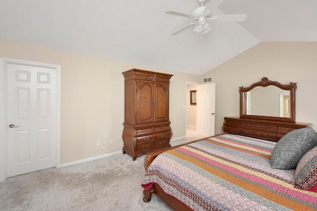 bedroom with lofted ceiling, ceiling fan, and light carpet