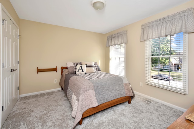 bedroom with light carpet