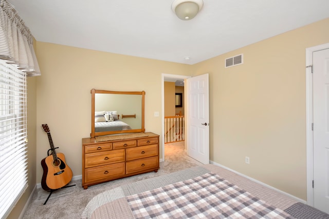 bedroom with light carpet