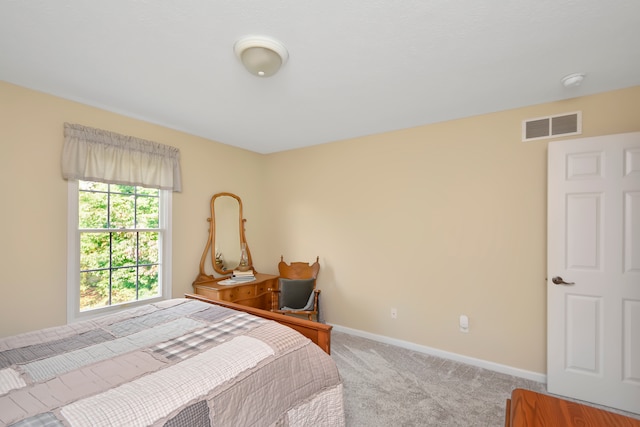 bedroom with light carpet