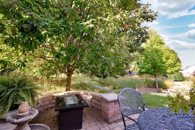 view of patio with an outdoor fire pit