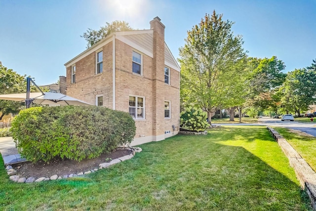 view of property exterior featuring a lawn