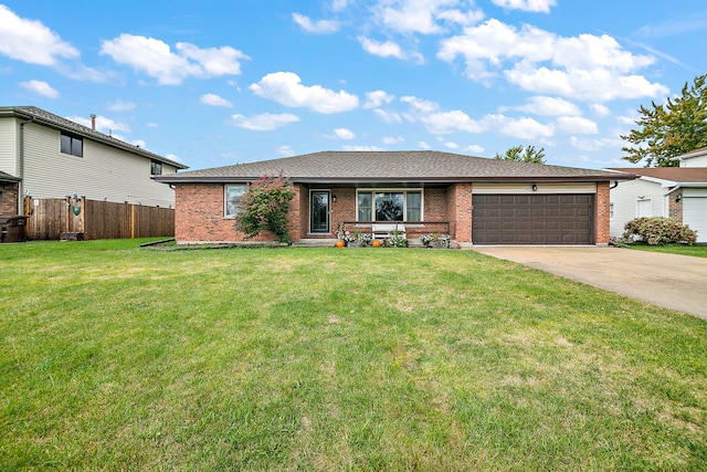 single story home with a front yard and a garage