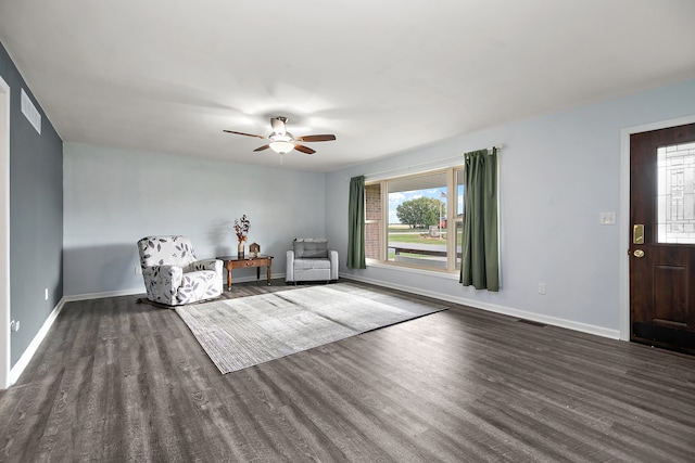 unfurnished room featuring ceiling fan and dark hardwood / wood-style flooring