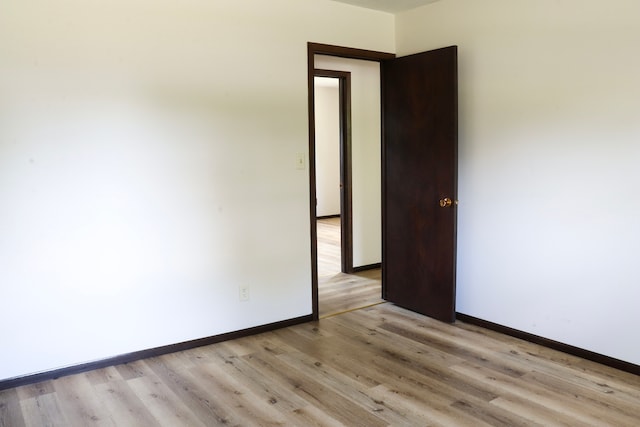 unfurnished room featuring light wood-type flooring