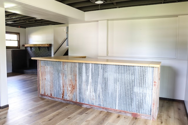 bar featuring hardwood / wood-style flooring