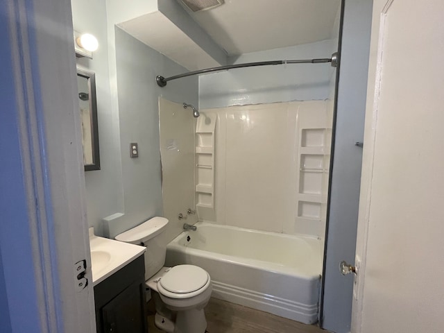 full bathroom featuring vanity, shower / bath combination, hardwood / wood-style floors, and toilet