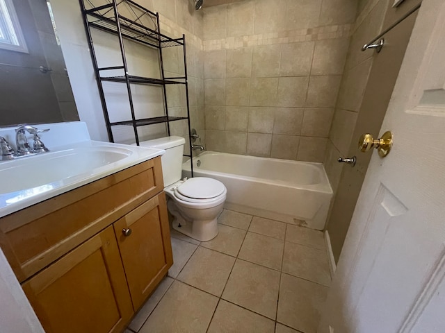 full bathroom with vanity, tiled shower / bath combo, toilet, and tile patterned flooring