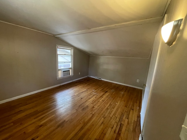 bonus room featuring wood-type flooring, vaulted ceiling, and cooling unit