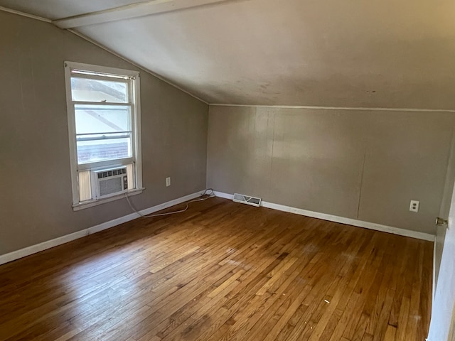 bonus room with wood-type flooring, vaulted ceiling with beams, and cooling unit