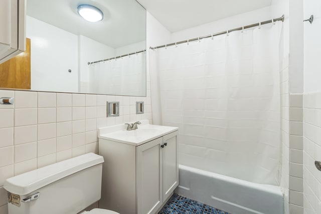 full bathroom featuring vanity, shower / tub combo, tile patterned floors, tile walls, and toilet