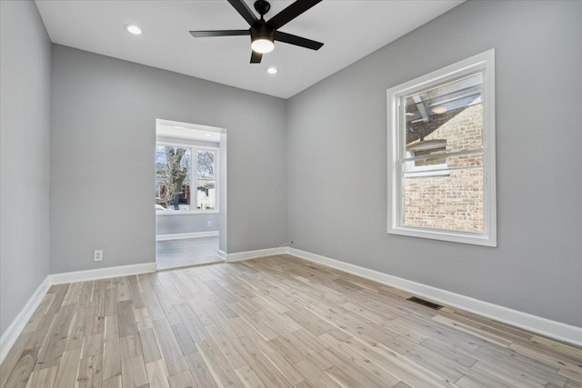 unfurnished room with light hardwood / wood-style floors and ceiling fan