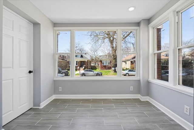 unfurnished room with plenty of natural light